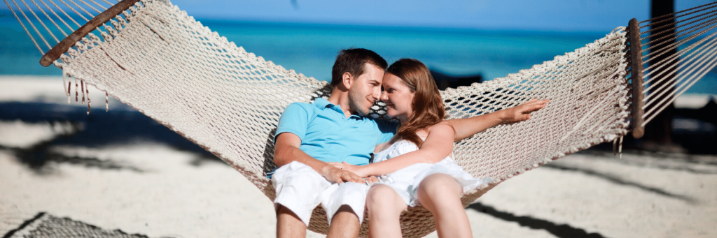 A couple embracing on a hammock in Costa Rica
